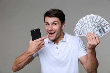 Sticker - Positive young man holding money.