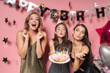 Image Of Adorable Party Girls Holding Birthday Cake With Candles