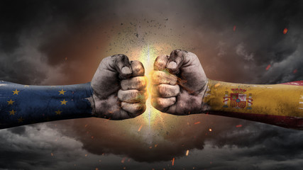 EU vs EU. Fists with flags. Battle EU with Spain on sky.