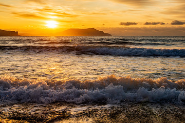 Wall Mural - picturesque sunrise over the Black Sea, waves roll on the sand