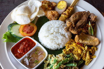 Nasi Campur Bali Bebek Betutu translate Balinese Mixed Duck Rice, Indonesian Balinese cuisine.