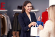 © Kalim - Shop assistant serving the customer in store