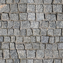 Seamless Texture Of Sidewalk Pavement Made Of Gray Granite Blocks. Wroclaw. Poland.