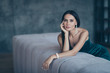 © deagreez - Photo of tenderness classy lady leaning on comfortable sofa waiting boyfriend home wear teasing classy formalwear short shiny dress apartments indoors