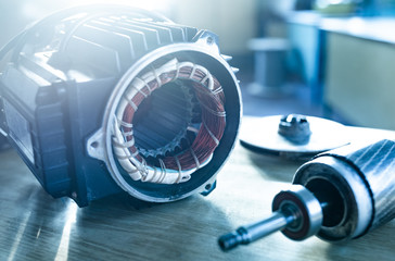 Wall Mural - Close-up of iron industrial motor lies on a table