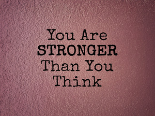 Wall Mural - Motivational and inspirational wording - You Are Stronger Than You Think. Blurred styled background.