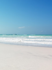 sand beach crystal clear water blu sky