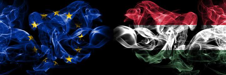 Eu, European union vs Hungary, Hungarian smoke flags placed side by side. Thick colored silky smokes abstract flags