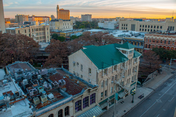 Historic buildings on Commerce St at Losoya St with Emily Morgan Hotel at the background at sunrise twilight in downtown San Antonio, Texas, USA.