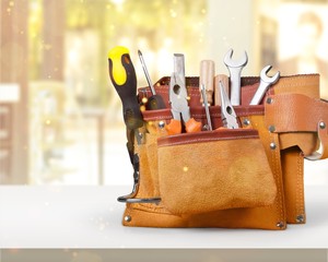 Wall Mural - Tool belt with tools on wooden background