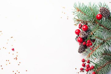 Wall Mural - christmas composition flatlay. spruce branches, red berries on white background with space for text
