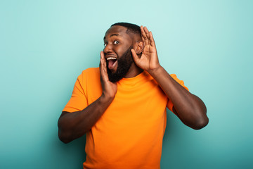 man hears a secret notice. concept of curiosity and gossip. amazed expression
