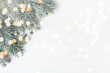 White Christmas background with spruce frosty brunches and Christmas lights