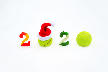 Wall Mural - Tennis Christmas and 2020 New Year concept with tennis balls and candles.