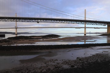 Firth of Forth at low tide with road bridges in background