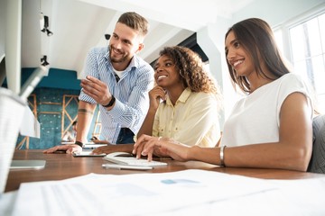 Canvas Print - Coworkers team picture in modern office. Project managers work new idea