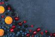 © alexmina - Blackberries,blueberries,raspberries,cherries on black concrete background. Healthy food