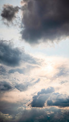 Wall Mural - beautiful sunny cloudscape in pastel colors of blue, white and yellow.
