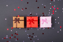 Holiday Shopping On Black Friday Concept. Three Boxes With Christmas Presents On A Dark Background.