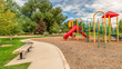 canvas print picture - Panorama frame Scenic view at a park with colorful childrens playground and benches on pathway