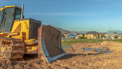 Wall Mural - Panorama Bulldozer at a construction site with copy space