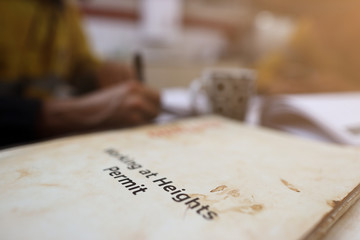Wall Mural - defocused of miner setting on the chair written job hazard analysis (jsa) working at height permit w