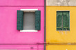 Windows of Venice, Murano and Burano. Picturesque windows with shutters on the famous island Burano. Decorated window on colorful wall in Burano island, Venice, Italy