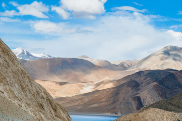 Landscape image of Pangong lake and mountains view background in Ladakh, India. Pangong is an endorheic lake in the Himalayas situated at a height of about 4,350 m.