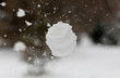 Snowball flies into the camera. The snowball shatters into snowflakes