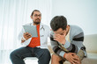 © Odua Images - sad patient consultation with doctor try to comfort him of the bad news