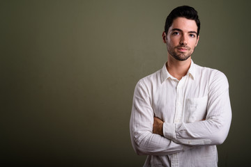 Wall Mural - Portrait of young handsome businessman with stubble beard