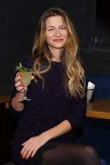 Pretty girl drinking cocktail in bar