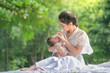 © subinpumsom - Beautiful mother and baby Family  in an Asian park