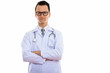 © Ranta Images - Portrait of young handsome man doctor with arms crossed
