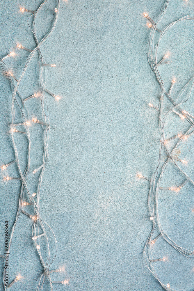 Beautiful Christmas lights on color background