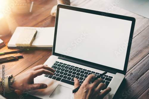 Fotomural Close up of male hands and laptop with blank screen