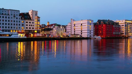 Wall Mural - Bergen, Norway. View of harbour modern buildings in Bergen, Norway during the sunrise. Famous landmarks in the morning. Time-lapse with boats, panning video