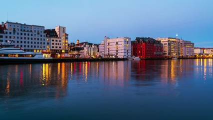 Wall Mural - Bergen, Norway. View of harbour modern buildings in Bergen, Norway during the sunrise. Famous landmarks in the morning. Time-lapse with boats, zoom in