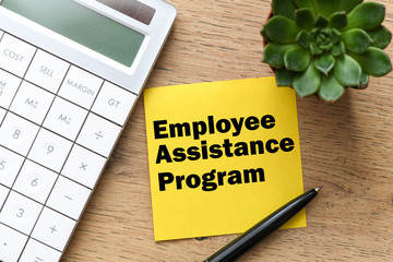 employee assistance program business text on the yellow card