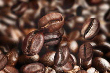 Pile of roasted coffee beans as background, closeup