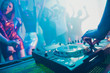 © deagreez - Dj playing performing stereo sound rhythm trance techno style set for attractive stylish cheerful positive people crowd having fun weekend festive concert at fashionable modern nightclub