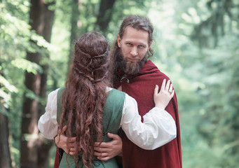 Brave Warrior Viking man with beautiful medieval woman