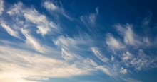 Cirrus Clouds Flying Against A Blue Sky
