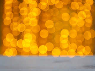 Christmas and New Year golden yellow background with abstract blurred highlights. Bokeh in blur.