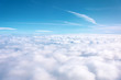 © aapsky - Aerial view of cloudy fields and horizon with day blue sky.