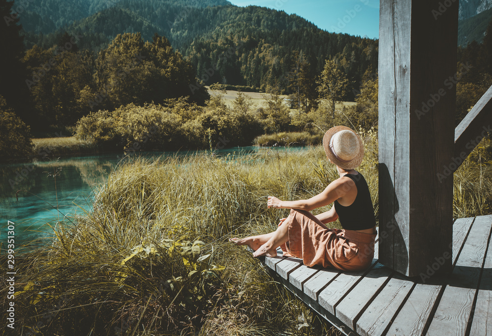 Woman enjoying freedom on nature outdoors. Travel Slovenia Europe. - obrazy, fototapety, plakaty 