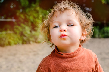 Wall Mural - pretty little girl giving a kiss