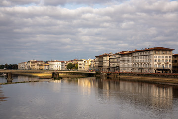 Wall Mural - FLORENCE, TUSCANY/ITALY - OCTOBER 20 : View of buildings along and across the River Arno in Florence  on October 20, 2019. Unidentified people.