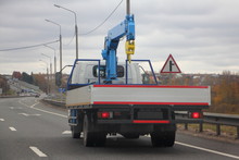 Self Loaded Lift Little 3 Ton Crane Truck On Autumn Road