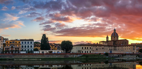 Wall Mural - FLORENCE, TUSCANY/ITALY - OCTOBER 19 : View of buildings along the River Arno at dusk  in Florence  on October 19, 2019